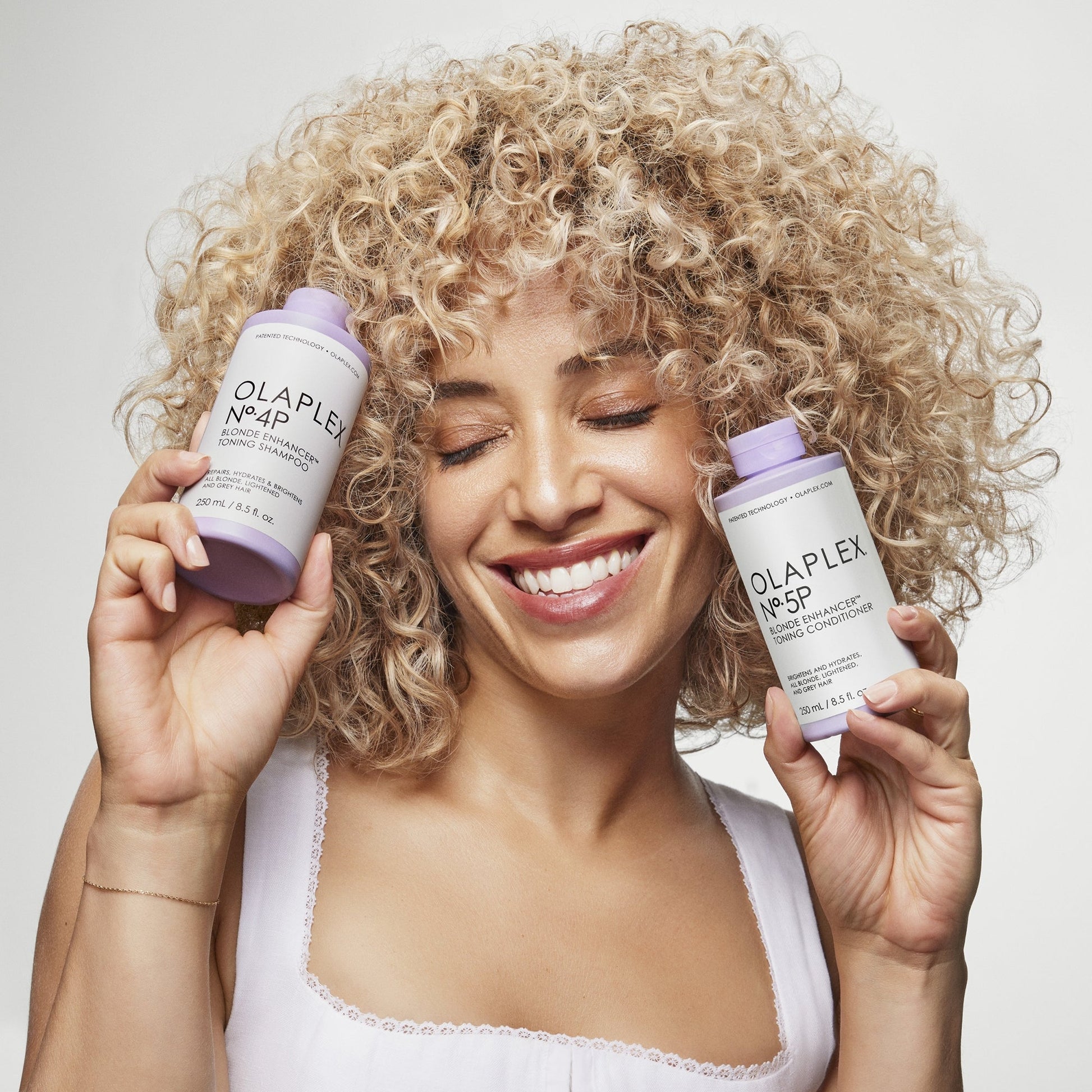 Olaplex No.4P Blonde Hair Hydrating and Brightening Purple Toning Shampoo - Image 9